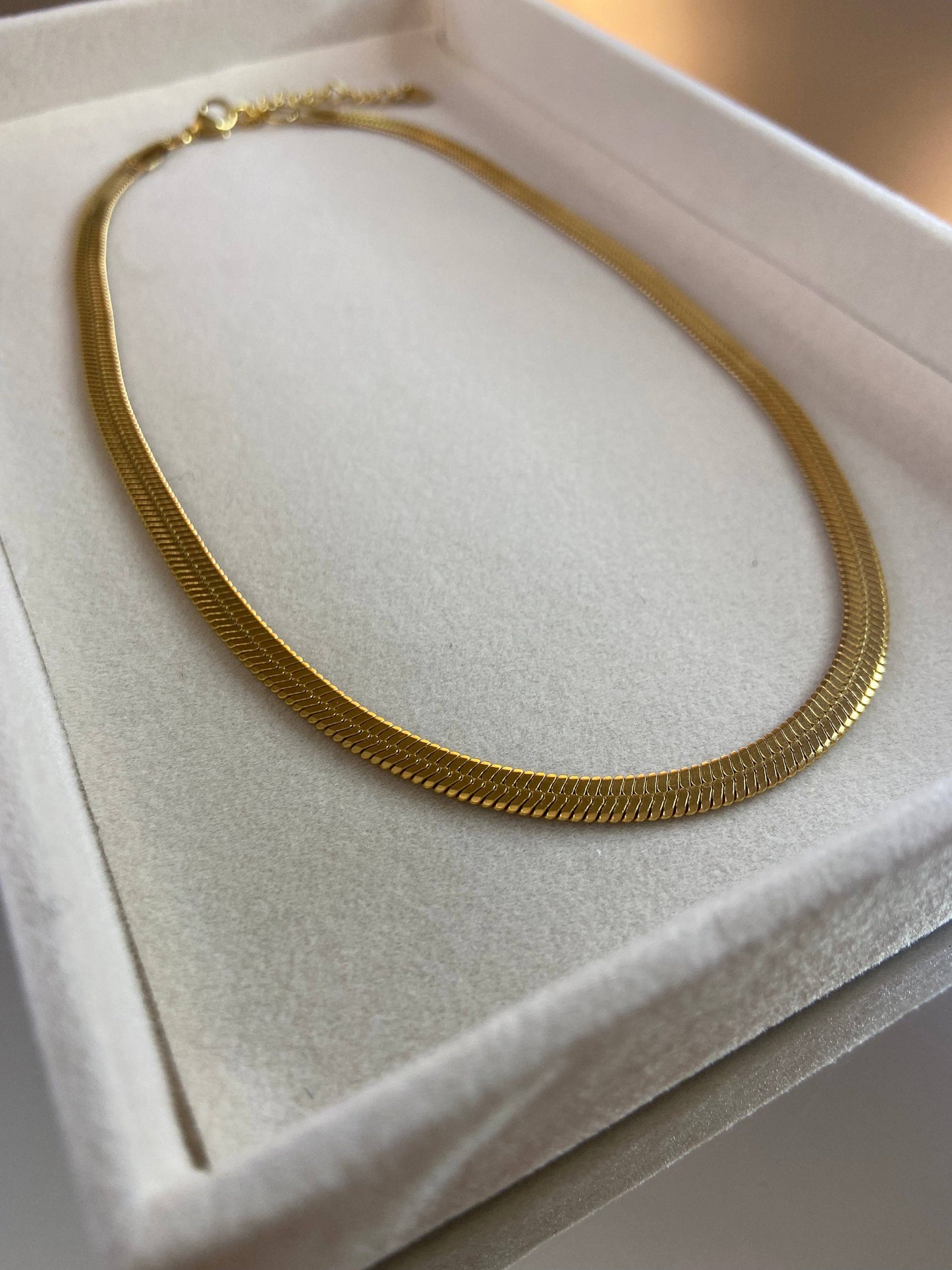 COLLIER EN ACIER - Doré
