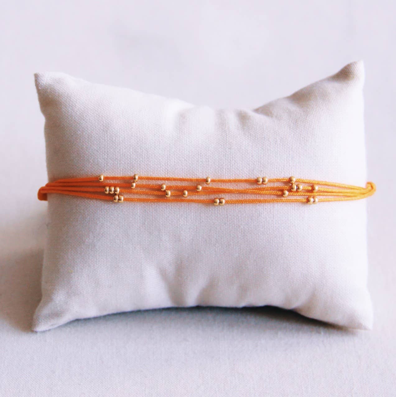 BRACELET EN PERLES - orange