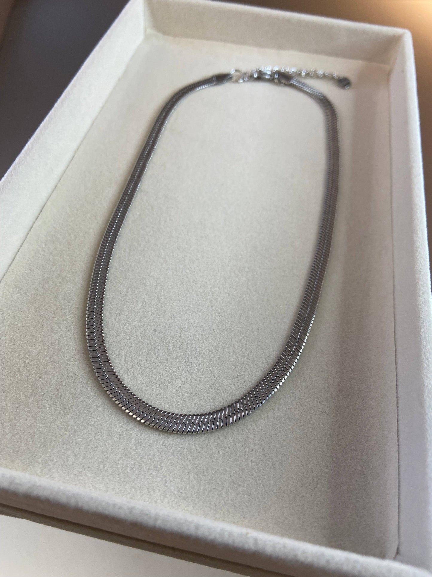 COLLIER EN ACIER - Doré