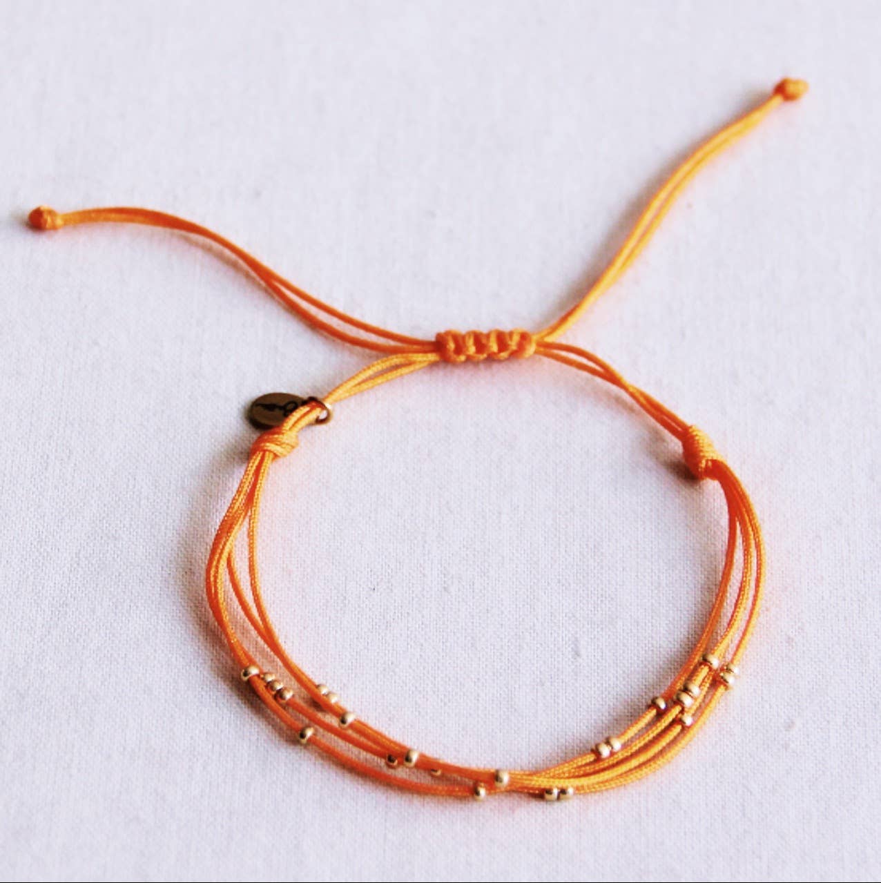 BRACELET EN PERLES - orange